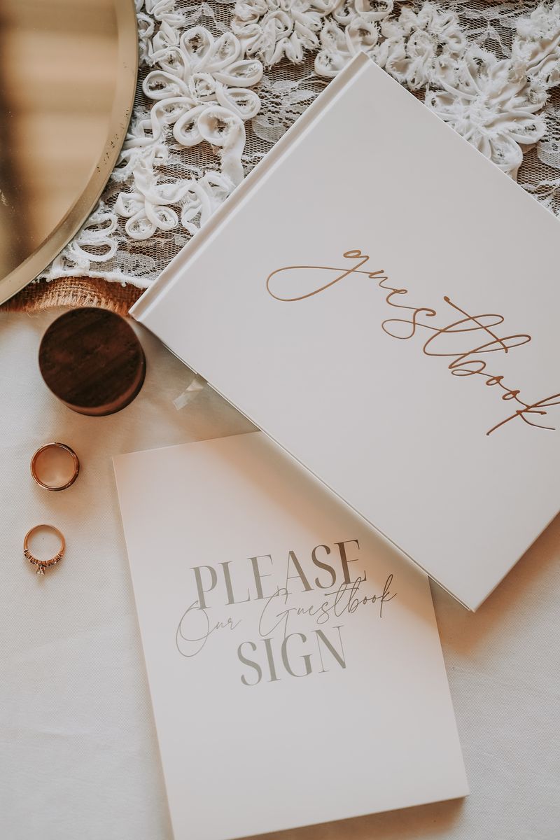 Guestbook sign, rings and a hand-lettered note