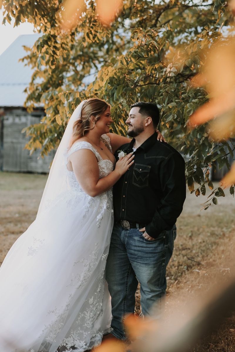Knox and Rebecca under the old oak at golden hour